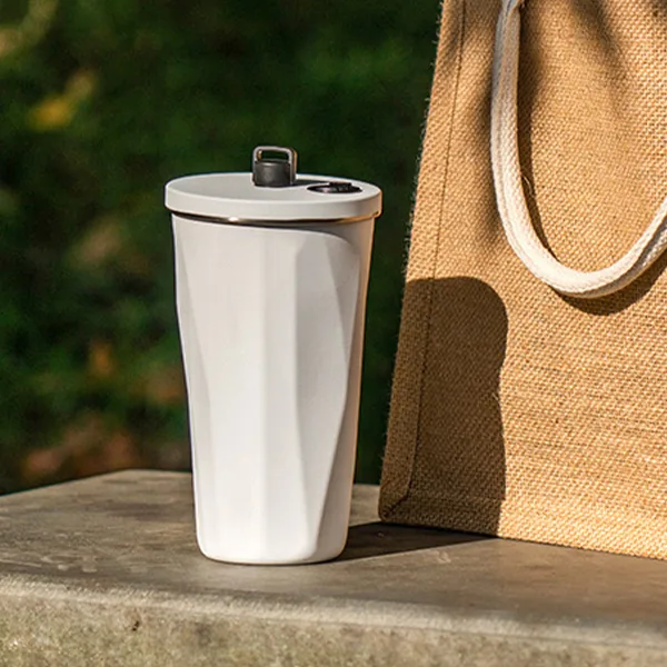 Coffee tumbler in minimalist white
